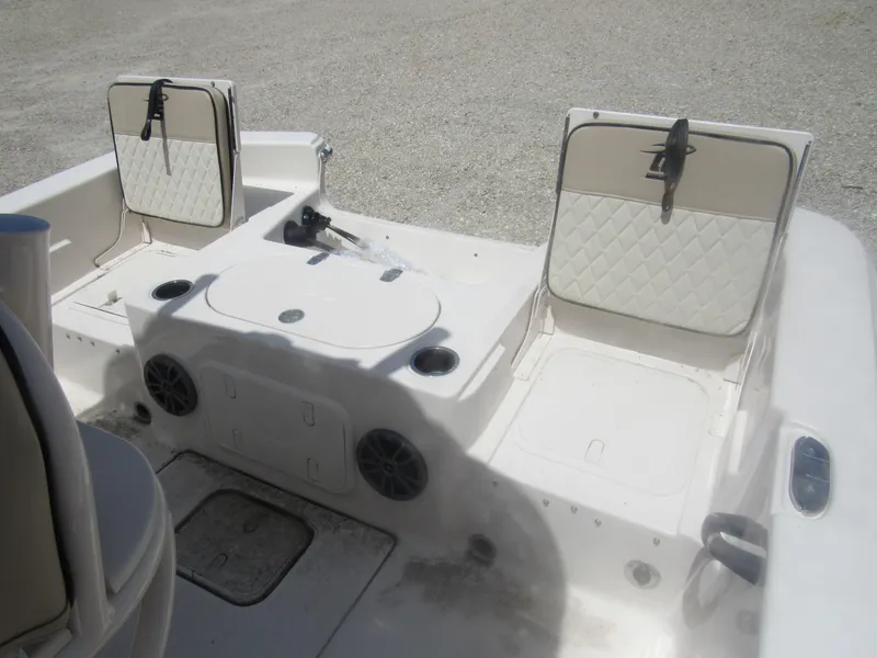 Slide: The Image of 2022 Carolina Skiff 21 LS boat interior with seating and storage compartments. - 6
