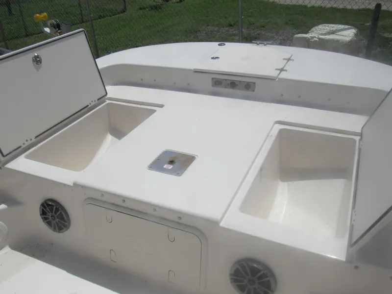 Slide: The Image of 2022 Carolina Skiff 21 LS boat storage compartments and speakers on deck. - 9