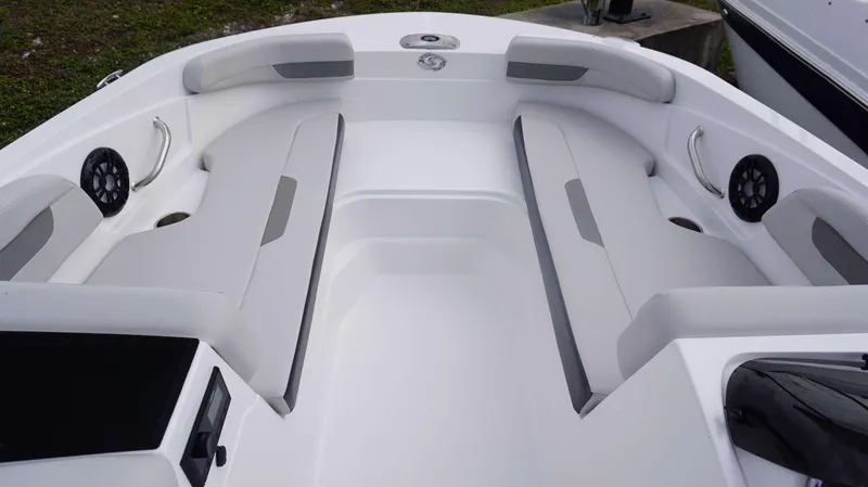Slide: The Image of 2023 Hurricane 185 SS boat interior with cushioned seating and built-in speakers. - 12