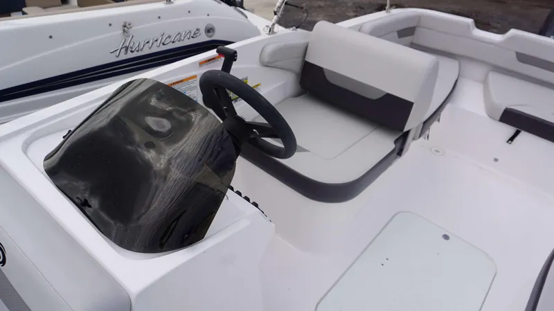Slide: The Image of 2023 Hurricane 185 SS boat interior with steering wheel and seating. - 15