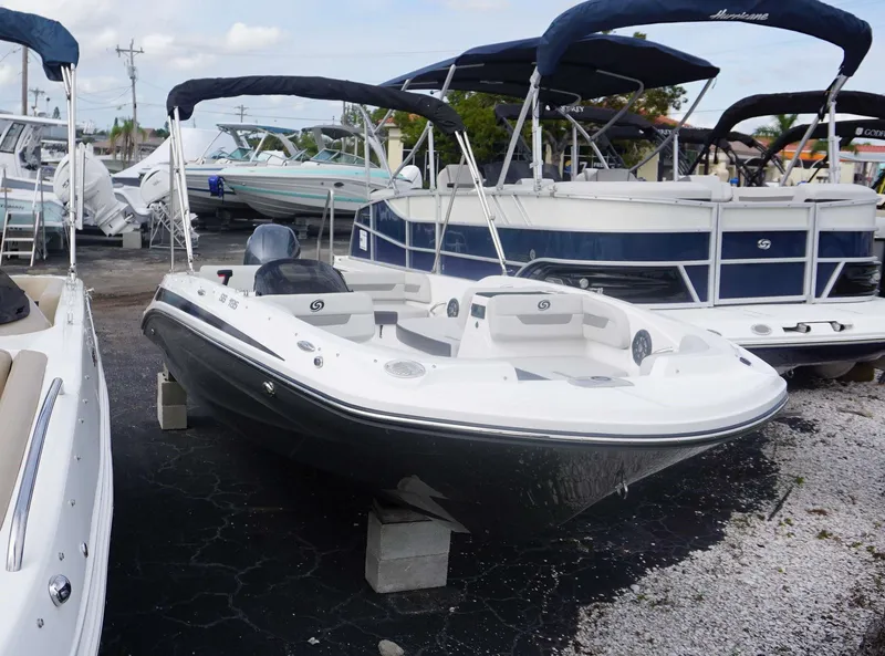 Slide: The Image of 2023 Hurricane 185 SS boat with black hull and white interior on display. - 17