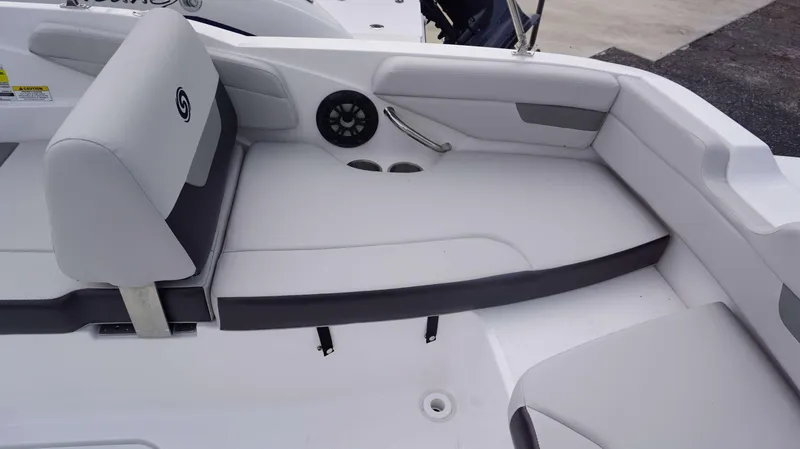 Slide: The Image of 2023 Hurricane 185 SS boat interior with white cushioned seating and cup holders. - 3
