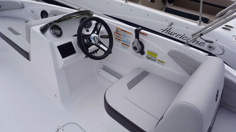 Slide: The Image of 2023 Hurricane 185 SS boat interior with steering wheel and seating. - 5