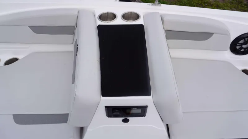 Slide: The Image of 2023 Hurricane 185 SS boat interior with cup holders and audio system. - 6