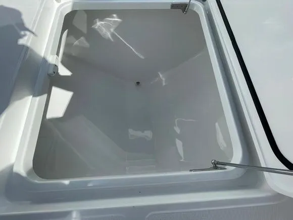 Slide: The Image of 2025 Mag Bay 43 Center Console storage compartment. - 38