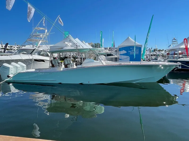 Slide: The Image of 2025 Mag Bay 43 Center Console boat docked at a marina. - 8