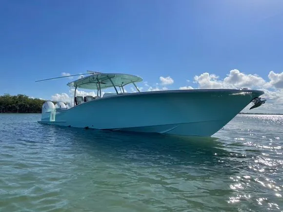 Slide: The Image of 2025 Mag Bay 43 Center Console boat on clear water under blue sky. - 10