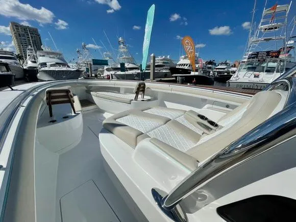 Slide: The Image of 2025 Mag Bay 43 Center Console boat at a marina with other yachts. - 32