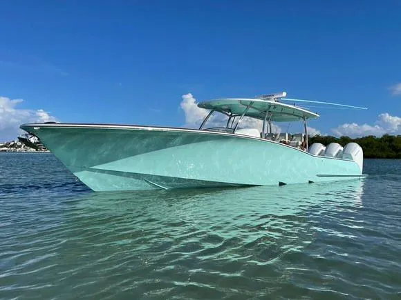Slide: The Image of 2025 Mag Bay 43 Center Console boat on clear water. - 9
