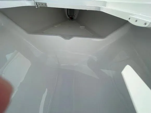 Slide: The Image of 2025 Mag Bay 43 Center Console storage compartment interior. - 39