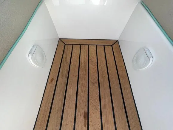 Slide: The Image of 2025 Mag Bay 43 Center Console teak deck with built-in speakers. - 35