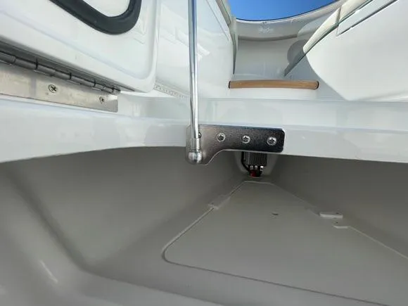 Slide: The Image of 2025 Mag Bay 43 Center Console boat interior detail showing clean, white surfaces and stainless steel hardware. - 41