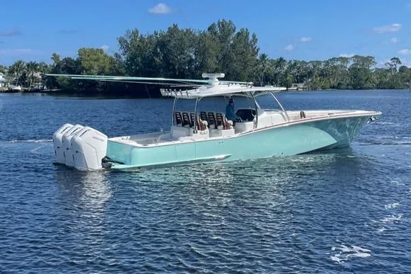 Slide: The Image of 2025 Mag Bay 43 Center Console boat on a calm lake. - 1