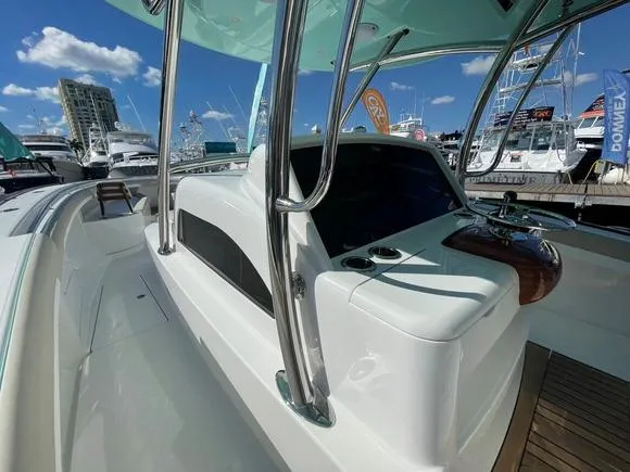 Slide: The Image of 2025 Mag Bay 43 Center Console boat at a marina, showcasing sleek design and modern features. - 29