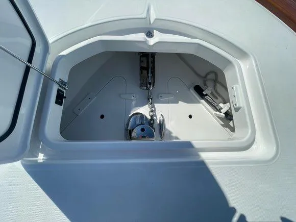 Slide: The Image of 2025 Mag Bay 43 Center Console anchor locker with chain and windlass. - 37