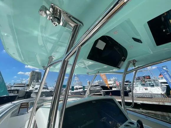 Slide: The Image of 2025 Mag Bay 43 Center Console boat at a marina, showcasing its sleek design. - 30