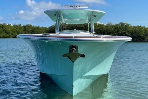 Slide: The Image of 2025 Mag Bay 43 Center Console boat on calm water. - 5