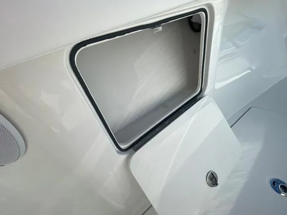 Slide: The Image of Open storage compartment on a 2025 Mag Bay 43 Center Console boat. - 42
