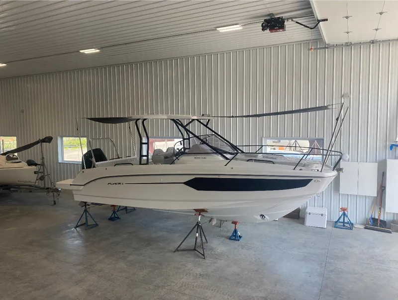 Slide: The Image of 2024 Beneteau Flyer 8 SUNdeck boat in a storage facility. - 0