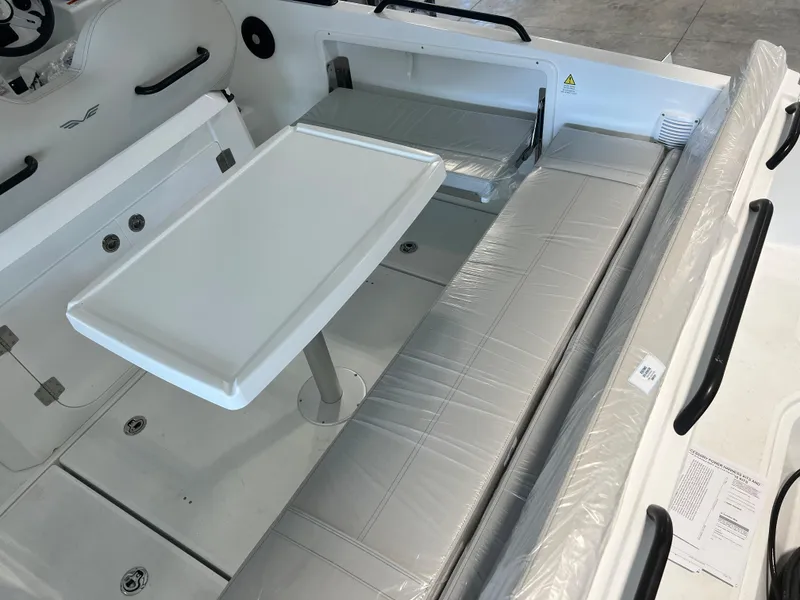 Slide: The Image of 2024 Beneteau Flyer 8 SUNdeck interior seating and table area. - 3