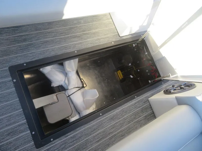 Slide: The Image of 2023 Montara SURF BOSS MT2.0 25 interior storage compartment with gray flooring. - 10
