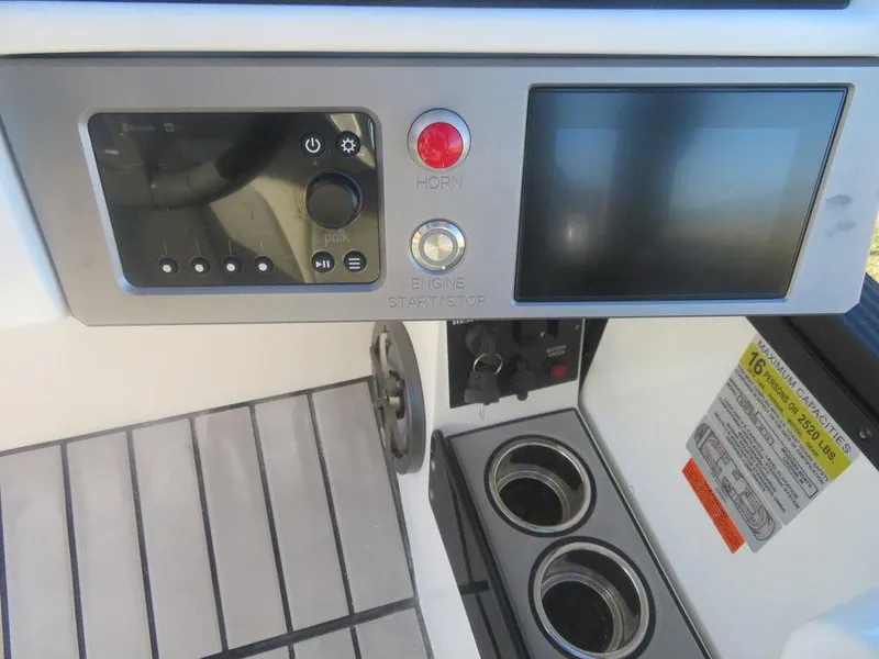 Slide: The Image of 2023 Montara SURF BOSS MT2.0 25 control panel with touchscreen and cup holders. - 12