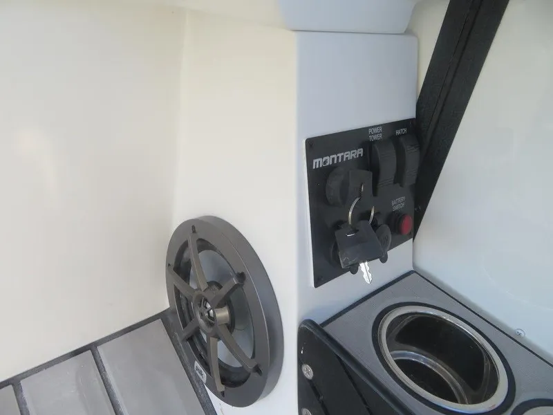 Slide: The Image of Control panel and speaker of 2023 Montara SURF BOSS MT2.0 25 boat. - 13