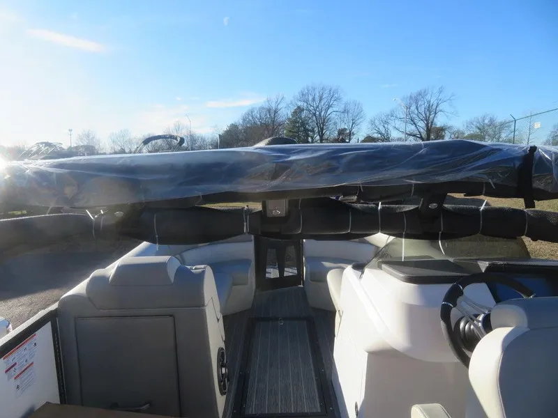 Slide: The Image of 2023 Montara SURF BOSS MT2.0 25 boat interior with seating and steering wheel. - 18