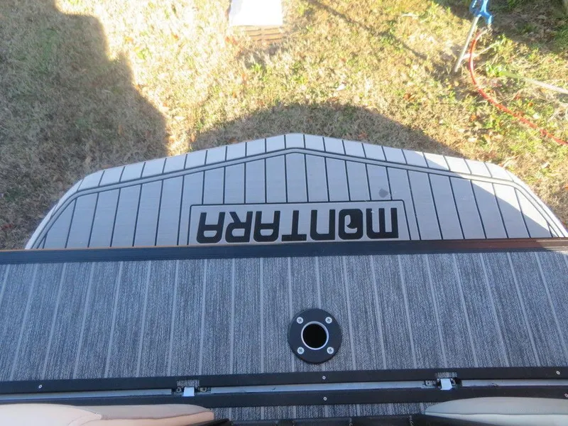 Slide: The Image of 2023 Montara SURF BOSS MT2.0 25 boat deck with Montara branding. - 20