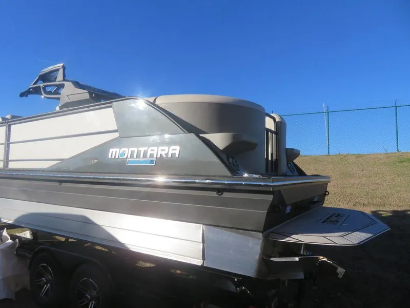 Slide: The Image of 2023 Montara SURF BOSS MT2.0 25 boat on trailer under clear blue sky. - 3