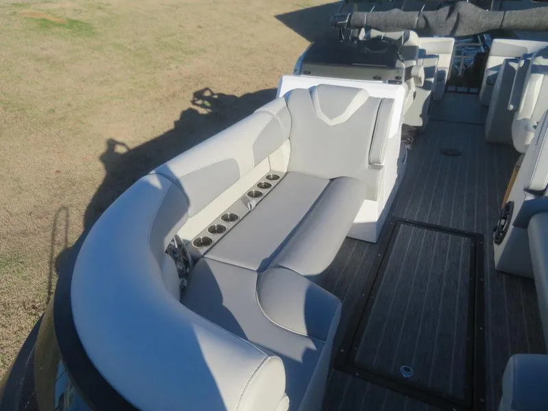 Slide: The Image of 2023 Montara SURF BOSS MT2.0 25 boat interior with gray seating and cup holders. - 6