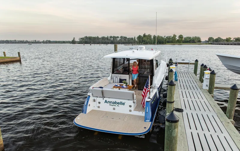 Slide: The Image of MJM 42 yacht "Annabelle" docked at a serene marina, 2025 model. - 26