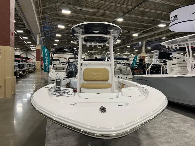 Slide: The Image of 2023 Sportsman 227 MASTERS boat displayed at an indoor boat show. - 10
