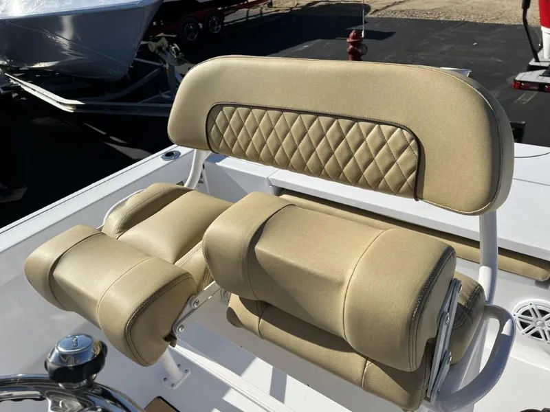 Slide: The Image of 2023 Sportsman 227 MASTERS boat with tan cushioned seating and diamond-stitched backrest. - 14
