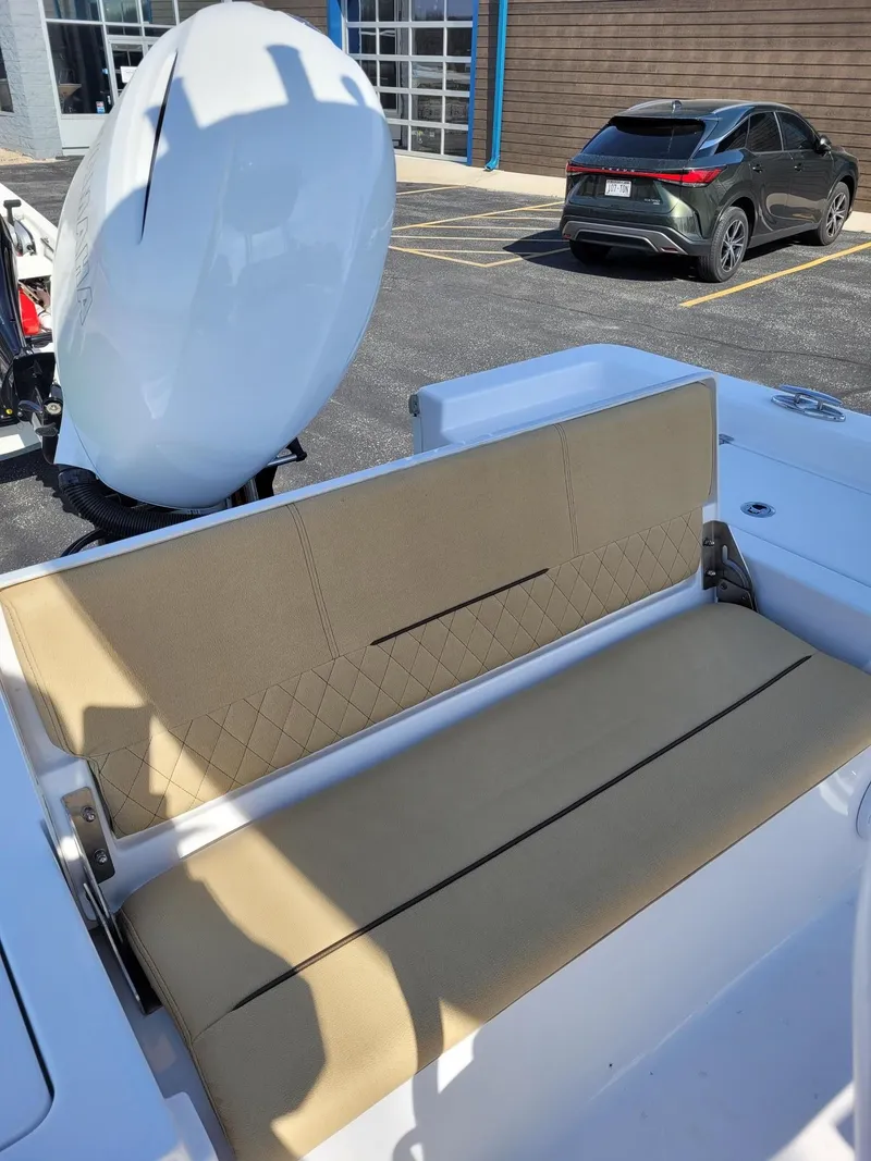 Slide: The Image of 2023 Sportsman 227 MASTERS boat with beige cushioned seating and Yamaha outboard motor. - 17