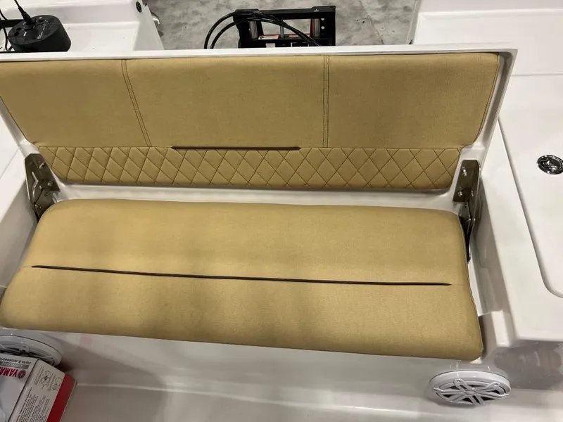 Slide: The Image of 2023 Sportsman 227 MASTERS boat with tan cushioned seating and diamond-stitched backrest. - 18