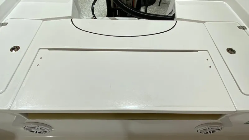 Slide: The Image of 2023 Sportsman 227 Masters boat deck with storage compartments and speakers. - 19