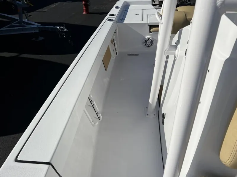 Slide: The Image of 2023 Sportsman 227 MASTERS boat interior with white deck and seating. - 21