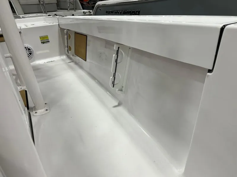 Slide: The Image of 2023 Sportsman 227 Masters boat interior, white deck and storage compartments. - 22