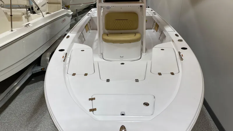 Slide: The Image of 2023 Sportsman 227 MASTERS boat interior with seating and storage compartments. - 23