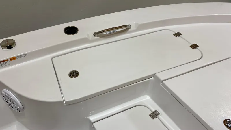 Slide: The Image of 2023 Sportsman 227 Masters boat deck with storage compartments and speaker. - 24