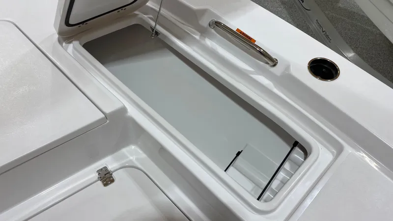 Slide: The Image of 2023 Sportsman 227 MASTERS boat storage compartment with open hatch. - 27