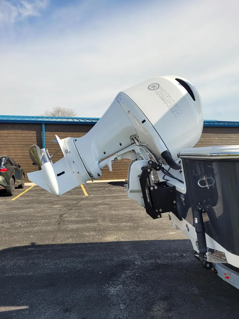 Slide: The Image of 2023 Sportsman 227 MASTERS boat with Yamaha outboard motor in parking lot. - 3