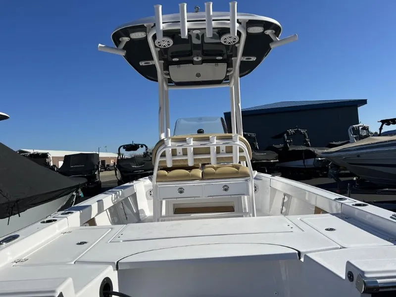 Slide: The Image of 2023 Sportsman 227 MASTERS boat with center console and T-top in a marina. - 4