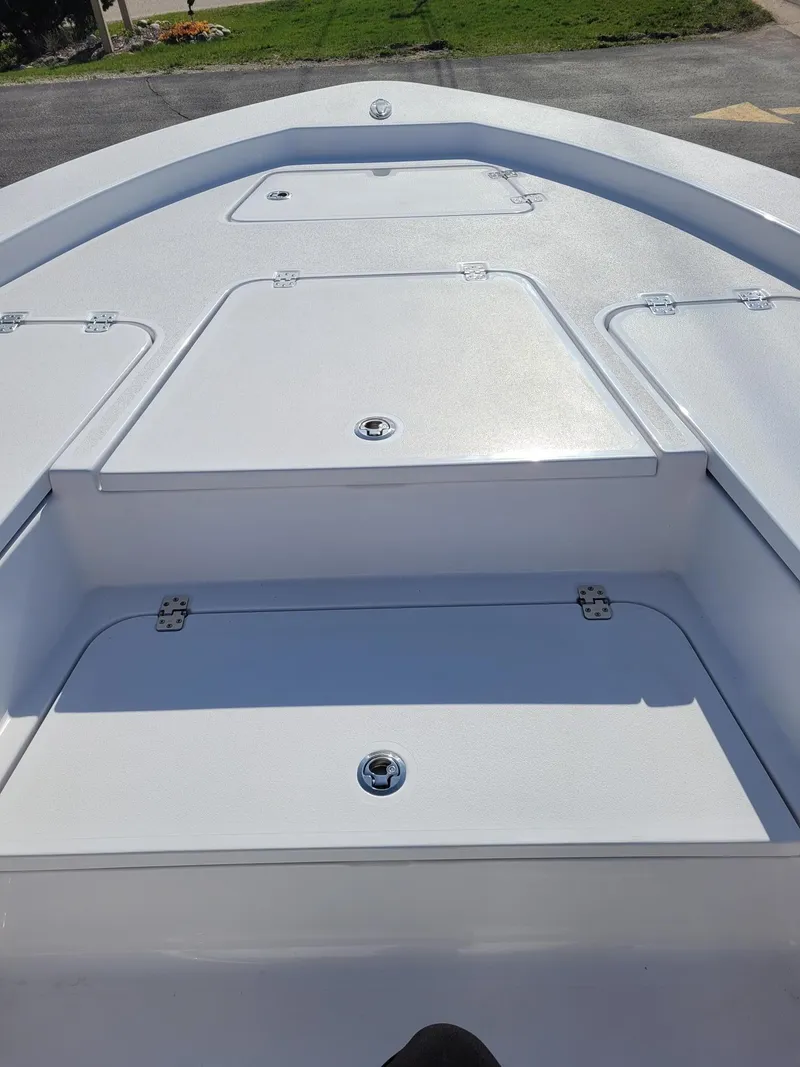 Slide: The Image of 2023 Sportsman 227 MASTERS boat deck with storage compartments. - 8