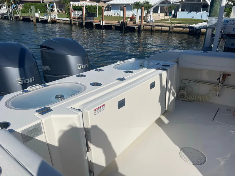 Slide: The Image of 2020 Cobia 301 Center Console with Yamaha engines by the water. - 6