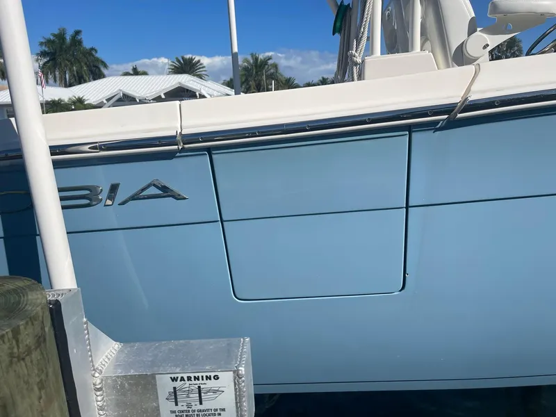 Slide: The Image of Cobia 301 Center Console boat, 2020 model, docked at marina. - 8