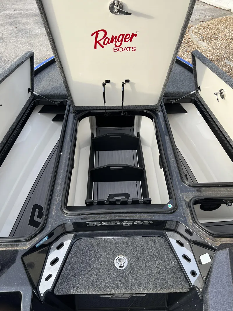 Slide: The Image of 2023 Ranger Z520R boat storage compartments open. - 10