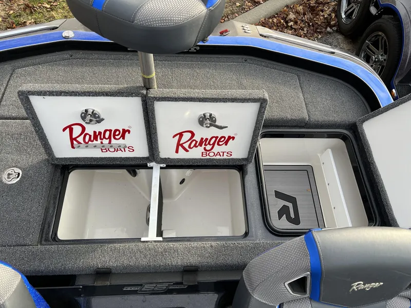 Slide: The Image of 2023 Ranger Z520R boat storage compartments and seating area. - 16
