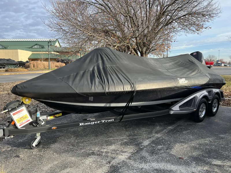 Slide: The Image of 2023 Ranger Z520R boat covered on a trailer in a parking lot. - 21